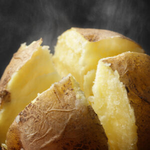 Steaming yellow baked potato