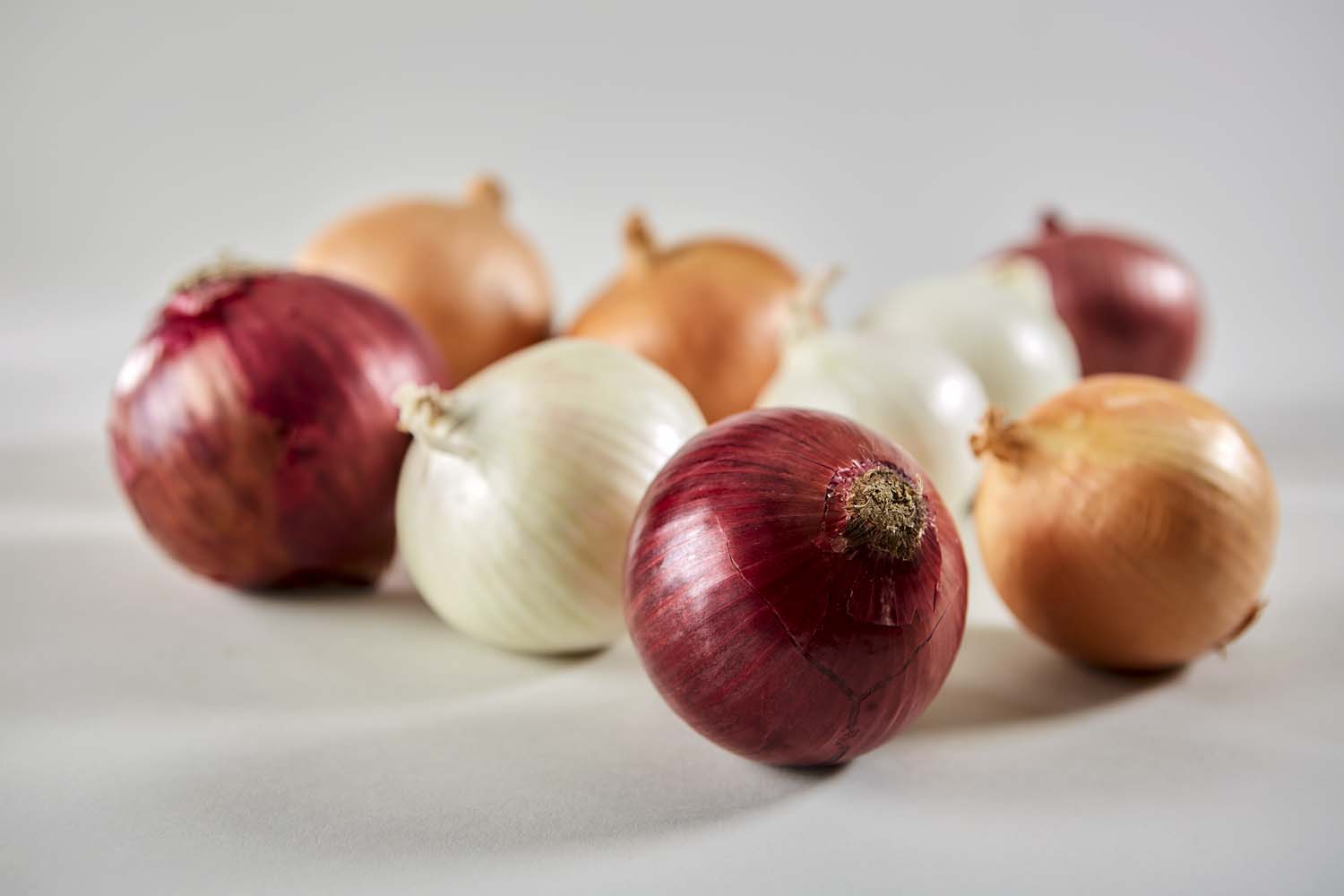 Red, yellow and white raw onions