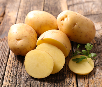 Raw sliced yellow potatoes