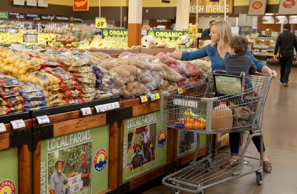 Women and child shopping in produce