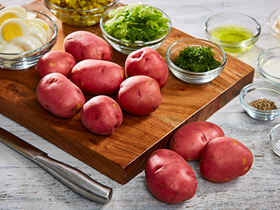 Red Potatoes on a cutting board